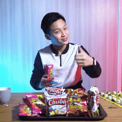 Young Man Thumbs Up Holding Chuba Snacks GIF