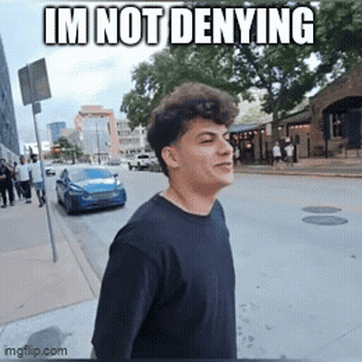 Young Man Walking Down Street Saying Im Not Denying GIF