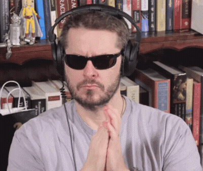 Young Man Waving Hands In Kitchen GIF