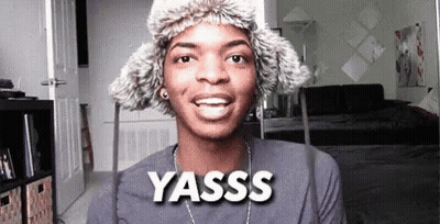 Young Man Wearing Fur Hat And Yasss Necklace GIF