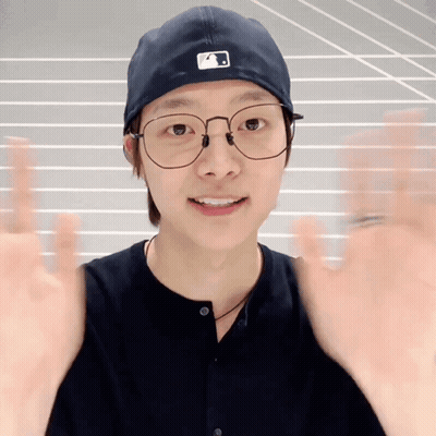 Young Man Wearing Glasses and A Hat