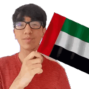 Young Man Wearing Glasses Holding UAE Flag Sticker