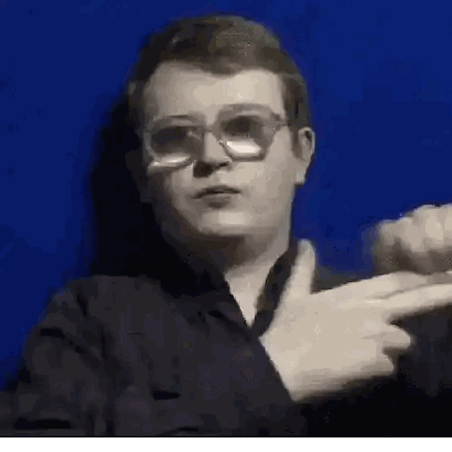 Young Man Wearing Glasses Pointing Sticker