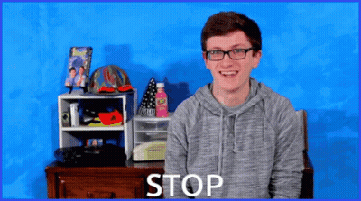 Young Man Wearing Glasses Saying Stop GIF