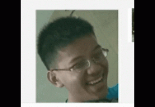 Young Man Wearing Glasses Smiling GIF
