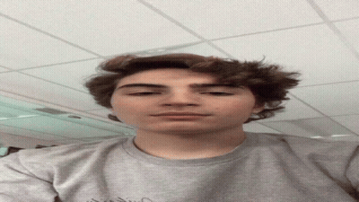 Young Man Wearing Grey Vision Shirt GIF