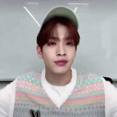 Young Man Wearing Hat And Vest Making Face GIF