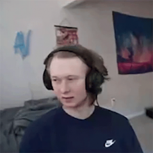 Young Man Wearing Headphones And Nike Shirt GIF