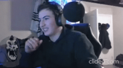 Young Man Wearing Headphones At Desk GIF