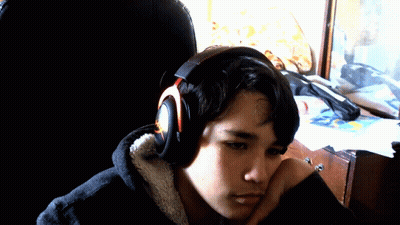 Young Man Wearing Headphones Looking Down GIF