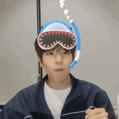 Young Man Wearing Shark Mask And Goggles GIF