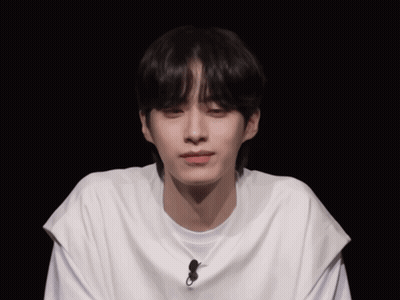 Young Man Wearing White T-Shirt With Microphone GIF