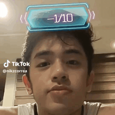 Young Man With 1/10 Sticker On Head GIF