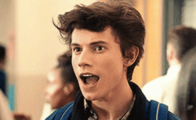 Young Man With Backpack Making Funny Face GIF