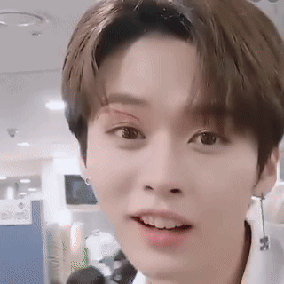 Young Man With Bandage On Eye And Earrings GIF