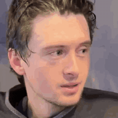 Young Man With Beard And Gray Shirt GIF