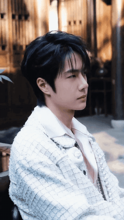 Young Man With Black Hair And White Jacket GIF