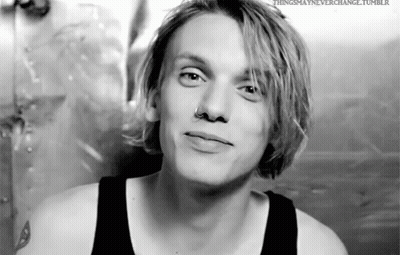 Young Man With Blonde Hair And Nose Ring In Black Tank Top GIF