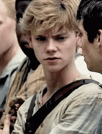 Young Man With Blonde Hair Making Funny Face In Crowd GIF