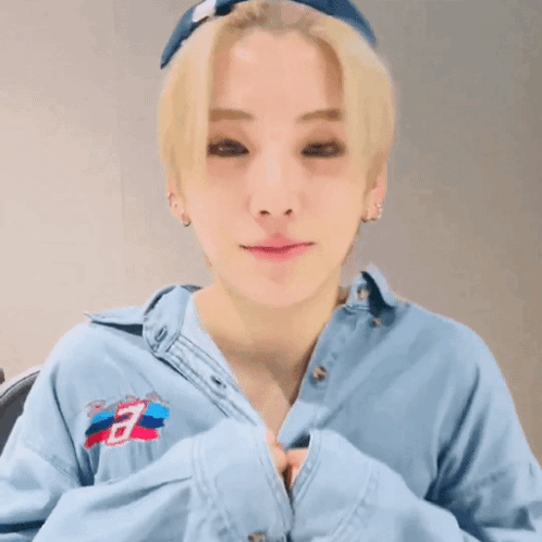 Young Man With Blonde Hair Wearing Blue Shirt With Letter B GIF