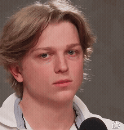 Young Man With Blonde Hair Wearing White Shirt And Black Microphone GIF