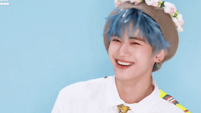Young Man With Blue Hair And Flower Hat GIF