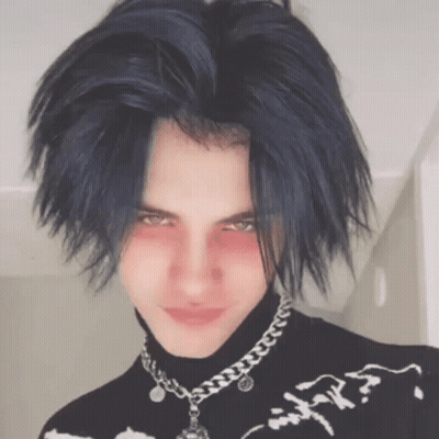 Young Man With Blue Hair In Black Turtleneck And Silver Chain GIF