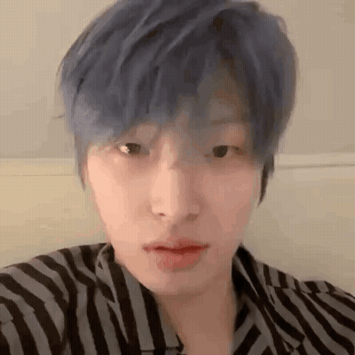 Young Man With Blue Hair In Striped Shirt GIF