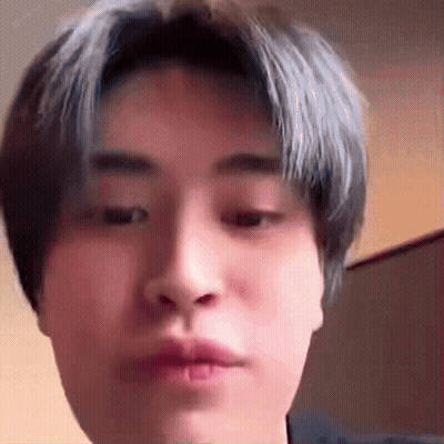 Young Man With Blue Hair Making Funny Face GIF