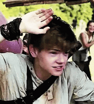 Young Man With Bracelet Touched By Hand GIF