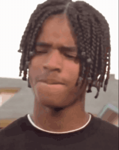 Young Man With Braids Making Funny Face GIF