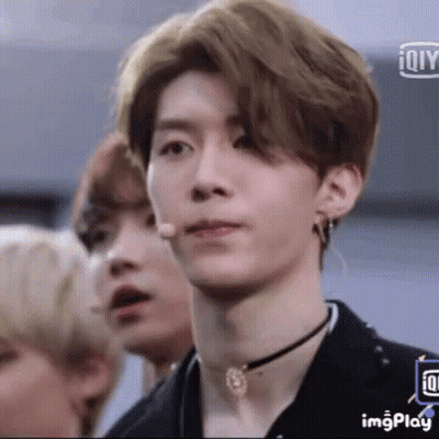 Young Man With Choker And Earrings At Microphone GIF