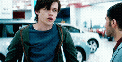 Young Man With Crutches Talking To Another Man GIF