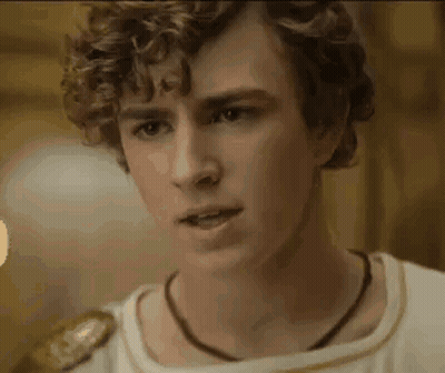 Young Man With Curly Hair And Necklace GIF