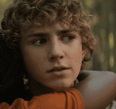Young Man With Curly Hair Hugging Woman GIF