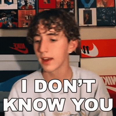 Young Man With Curly Hair Making Funny Face Saying I Don't Know You GIF