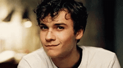 Young Man With Curly Hair Smiling GIF