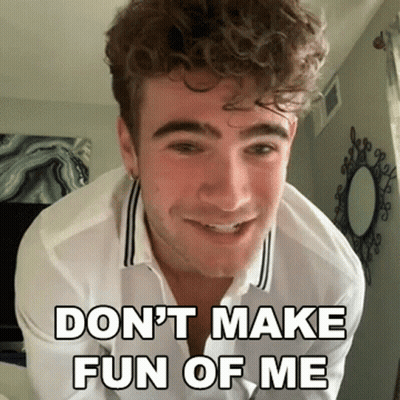 Young Man With Curly Hair Smiling Says Don't Make Fun Of Me GIF