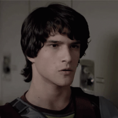 Young Man With Dark Hair Close Up GIF