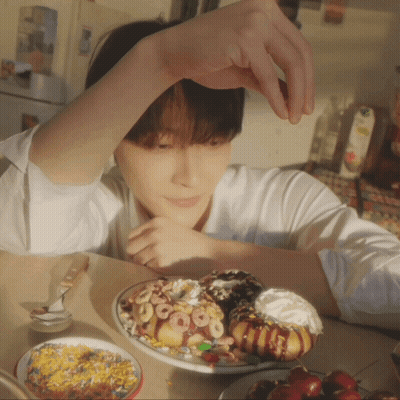 Young Man With Donuts And Cereal GIF
