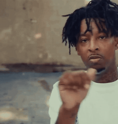 Young Man With Dreadlocks And Face Tattoo Pointing At Camera GIF