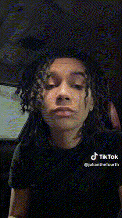 Young Man With Dreadlocks Making Funny Face In Car GIF