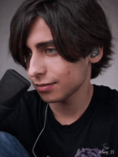 Young Man With Ear Buds And Mary 13 Black Shirt GIF