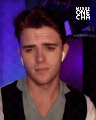 Young Man With Ear Buds Making Funny Face GIF