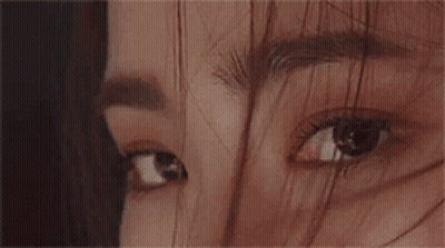 Young Man With Earbuds In Black Shirt Saying Mary 13 GIF