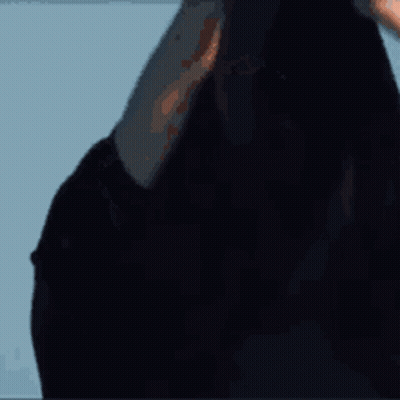 Young Man With Eyes Closed Against Blue Sky GIF