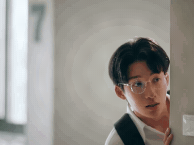 Young Man With Glasses And Backpack GIF