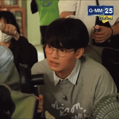 Young Man With Glasses And Gray Sweater GIF