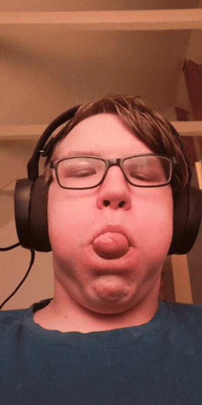Young Man With Glasses And Headphones Making Funny Face GIF