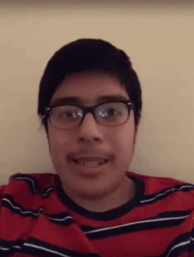 Young Man With Glasses And Mustache In Red And Black Shirt GIF